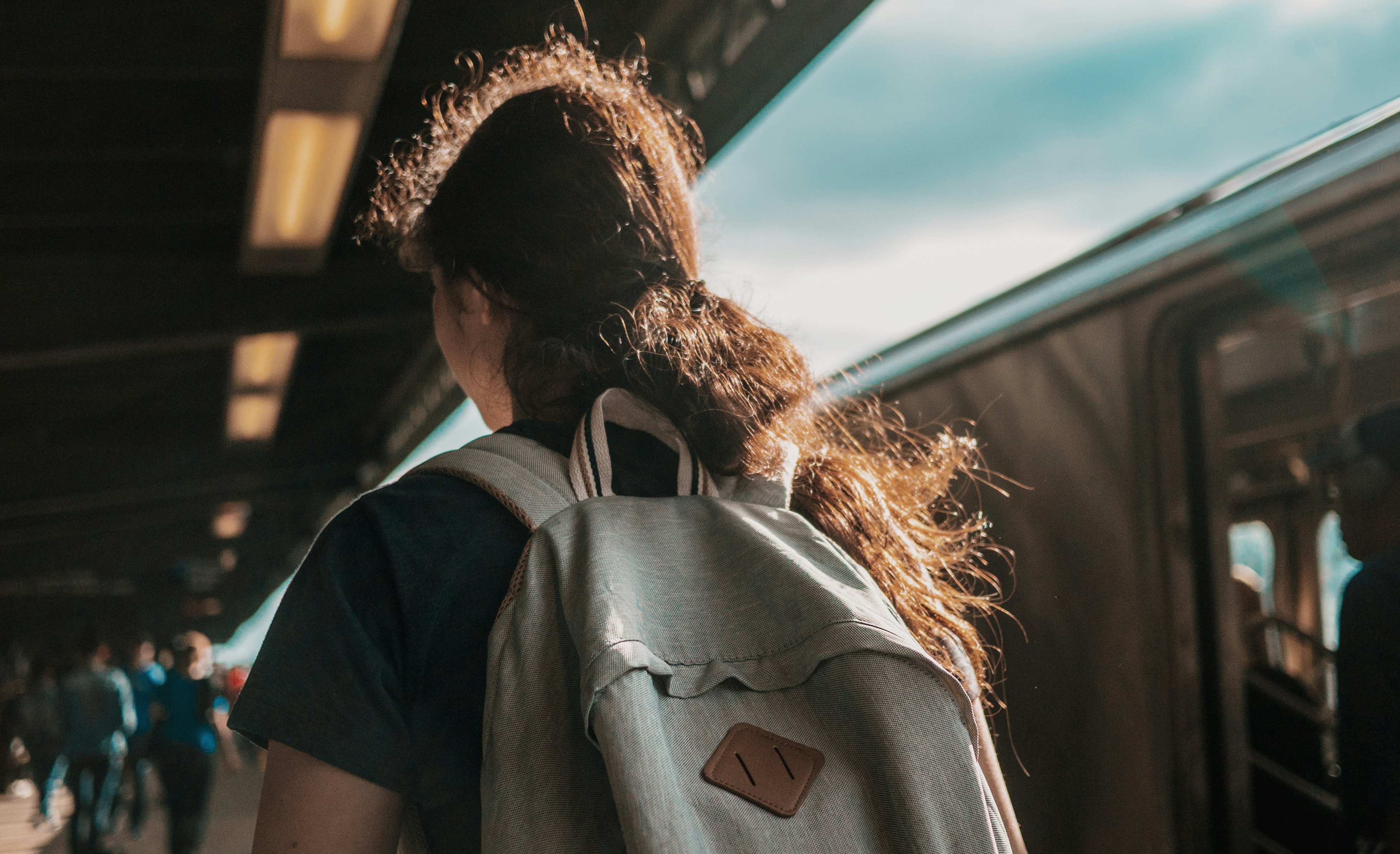 person wearing gray backpack